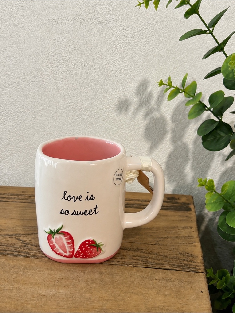 Rae Dunn “love is so sweet” mug with strawberries.